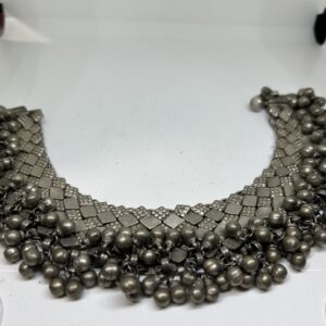 Heavy silver anklet with many balls